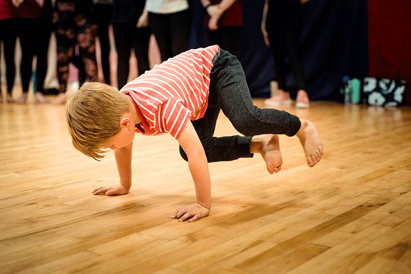 Very young break dance student practicing