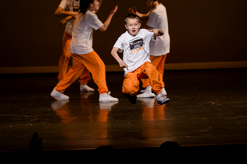 Break dance student crew performing on stage