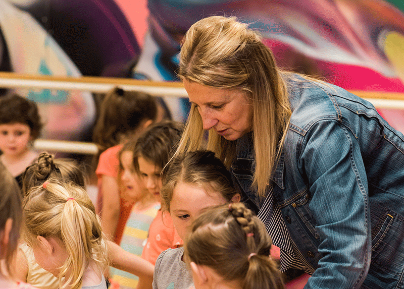 Mrs. Joyce instructing dance students