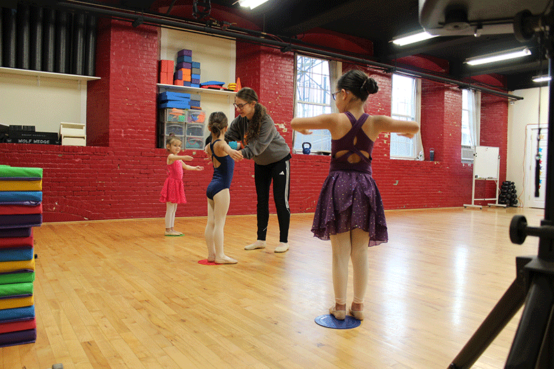 Ms. Sara working with young dancers